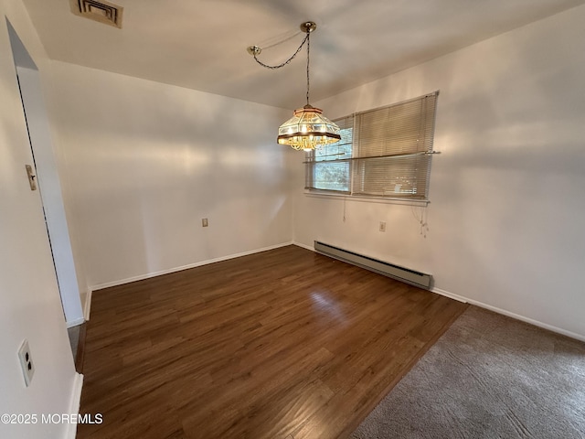 unfurnished dining area with an inviting chandelier, dark wood finished floors, visible vents, a baseboard heating unit, and baseboards