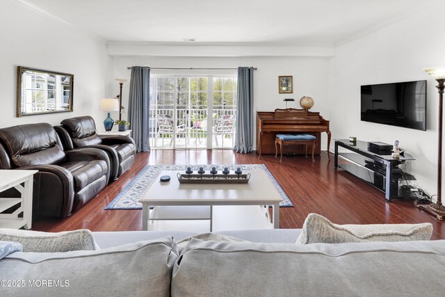 living room featuring ornamental molding and wood finished floors