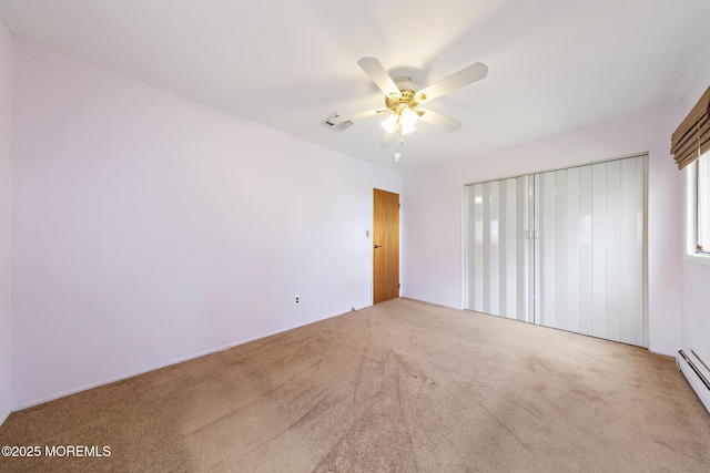 14B S Heron St, Manchester, NJ 08759 - unfurnished bedroom featuring carpet, a baseboard heating unit, and a ceiling fan