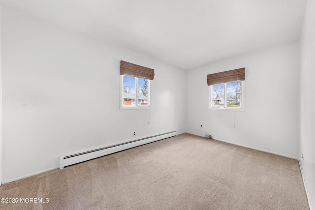 14B S Heron St, Manchester, NJ 08759 - carpeted spare room with a baseboard heating unit and plenty of natural light