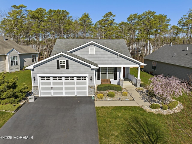 311 Newport Way, Little Egg Harbor, NJ 08087 - view of front of property with aphalt driveway, a front yard, and covered porch