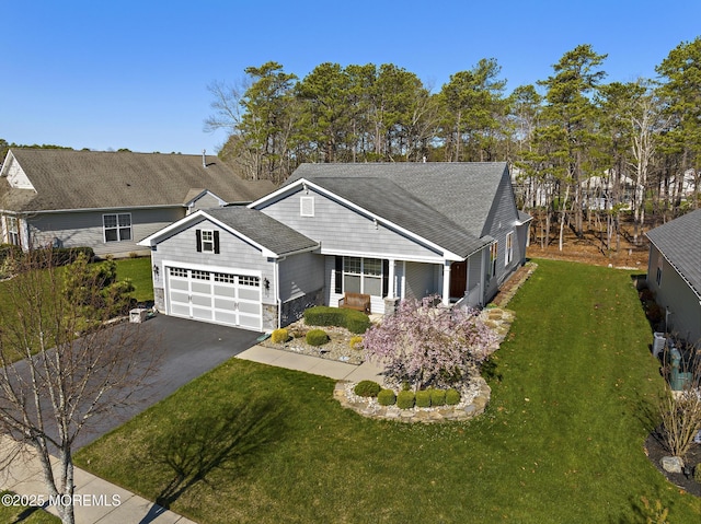 311 Newport Way, Little Egg Harbor, NJ 08087 - view of front of house with stone siding, driveway, a front yard, and a garage