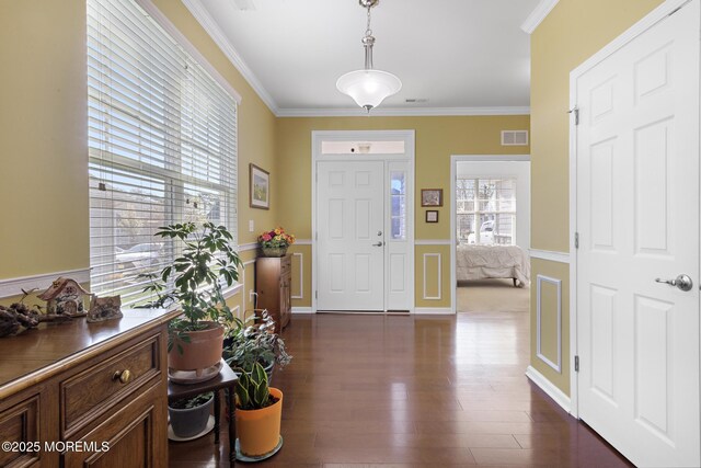 311 Newport Way, Little Egg Harbor, NJ 08087 - entrance foyer featuring wainscoting, dark wood finished floors, crown molding, and visible vents