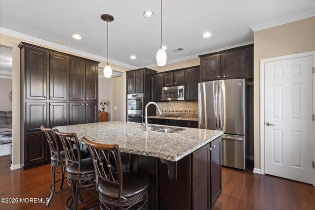 311 Newport Way, Little Egg Harbor, NJ 08087 - kitchen with a sink, dark brown cabinets, light stone countertops, dark wood-type flooring, and appliances with stainless steel finishes