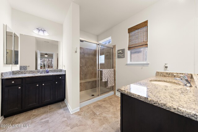 311 Newport Way, Little Egg Harbor, NJ 08087 - full bath featuring a shower stall, a sink, baseboards, tile patterned flooring, and two vanities