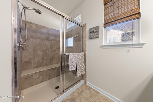 311 Newport Way, Little Egg Harbor, NJ 08087 - bathroom with a shower stall, baseboards, a healthy amount of sunlight, and tile patterned flooring