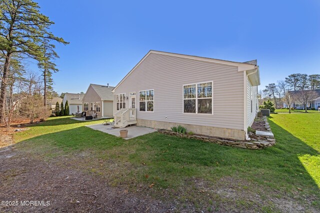 311 Newport Way, Little Egg Harbor, NJ 08087 - rear view of property featuring a patio area and a lawn