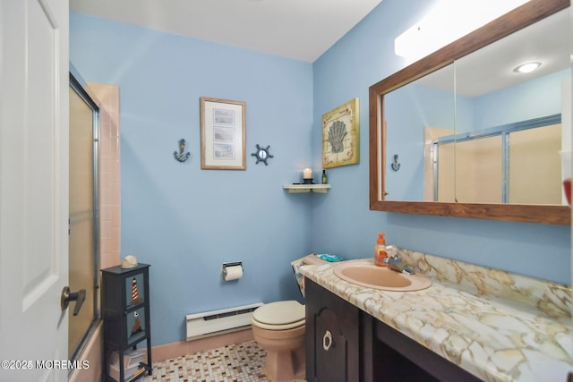 bathroom featuring baseboard heating, vanity, and toilet
