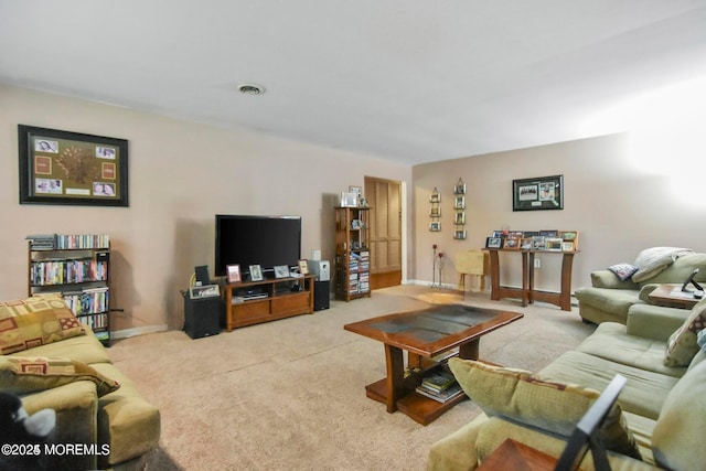 living room featuring light carpet, visible vents, and baseboards