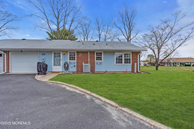 1237A Hamilton Ct, Lakewood, NJ 08701 - single story home with a garage, brick siding, driveway, and a front lawn