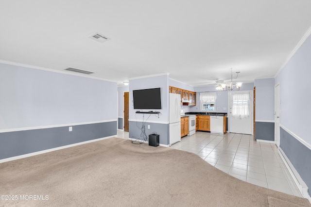 1237A Hamilton Ct, Lakewood, NJ 08701 - unfurnished living room with crown molding, visible vents, light tile patterned flooring, baseboards, and a notable chandelier