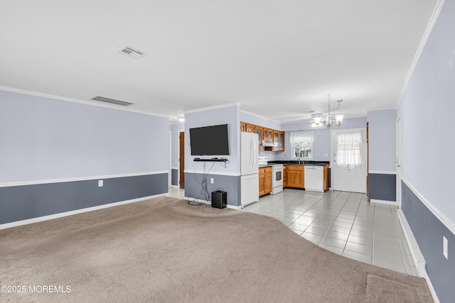 1237A Hamilton Ct, Lakewood, NJ 08701 - unfurnished living room with visible vents, light tile patterned floors, an inviting chandelier, ornamental molding, and light carpet