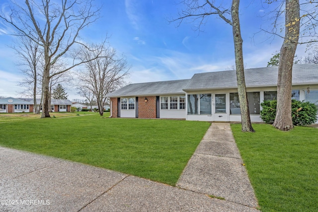 1237A Hamilton Ct, Lakewood, NJ 08701 - ranch-style house with roof with shingles, brick siding, and a front lawn