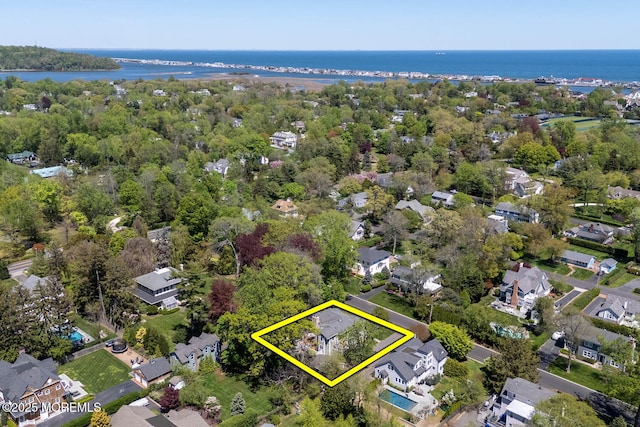 birds eye view of property featuring a water view and a residential view