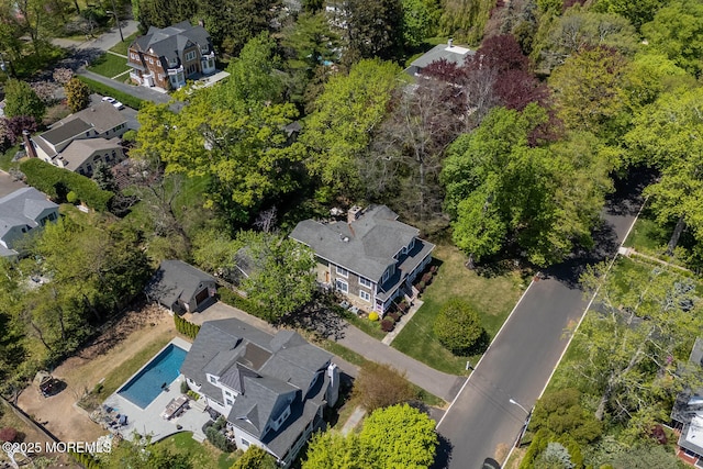 birds eye view of property with a residential view