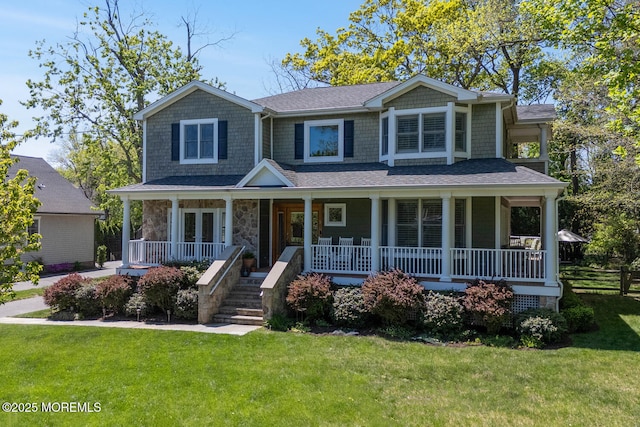 view of front facade with stone siding, a porch, and a front yard