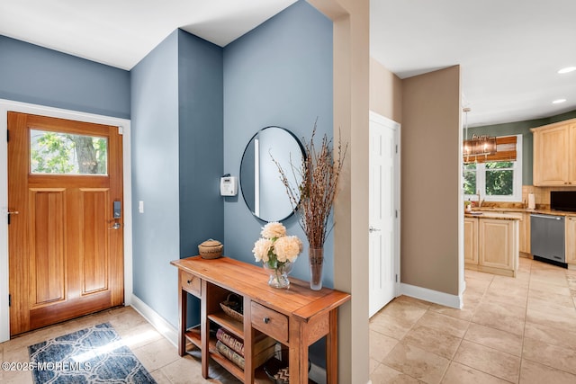 foyer with baseboards, recessed lighting, and light tile patterned floors