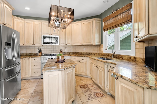 kitchen with light tile patterned flooring, a notable chandelier, appliances with stainless steel finishes, a sink, and backsplash