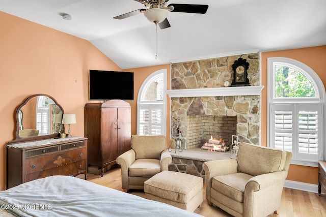 bedroom featuring ceiling fan, vaulted ceiling, and light wood-type flooring