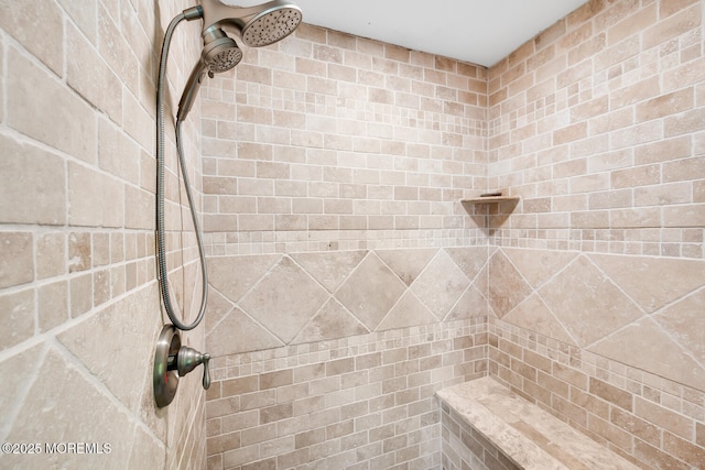 full bath featuring tiled shower