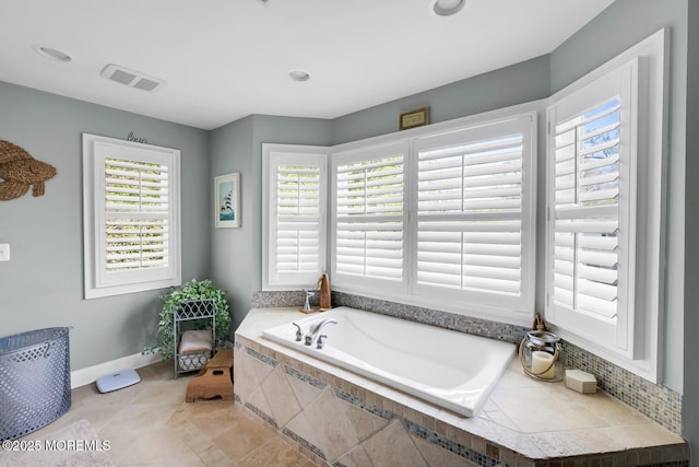bathroom featuring visible vents, recessed lighting, baseboards, and a garden tub