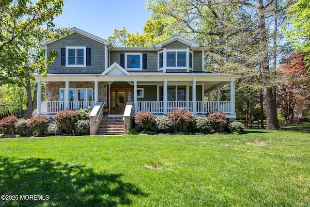 view of front facade with covered porch, stone siding, and a front lawn