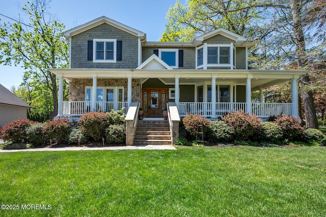 view of front of property with stone siding, a porch, and a front yard