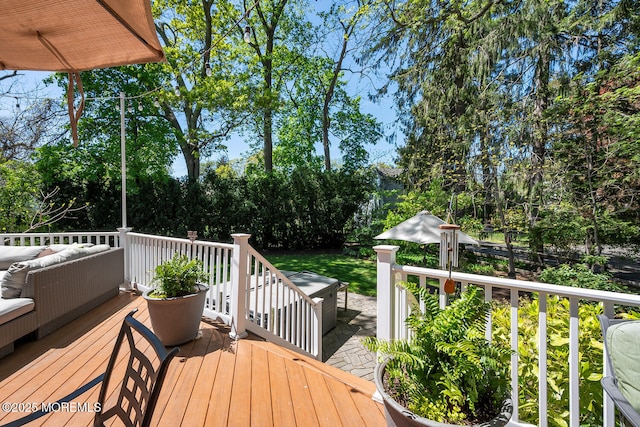 wooden terrace featuring outdoor lounge area