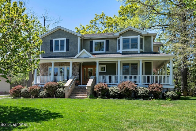 view of front of property featuring a front lawn, covered porch, and stone siding
