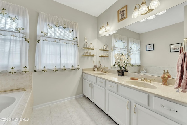 40 Isabella Dr, Manchester, NJ 08759 - full bath featuring a garden tub, double vanity, a sink, and baseboards