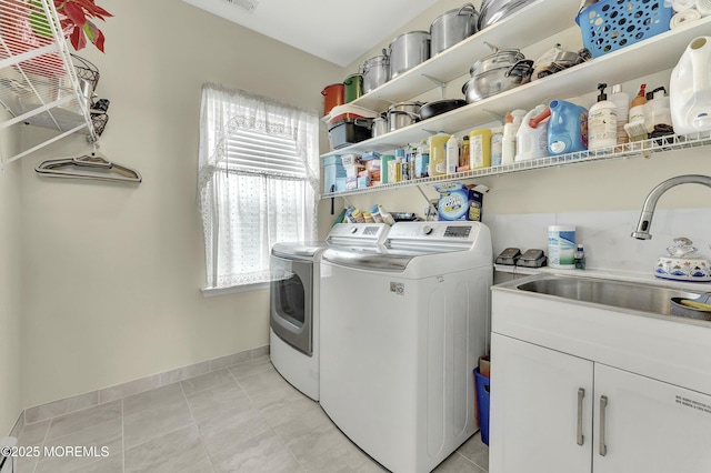 40 Isabella Dr, Manchester, NJ 08759 - laundry room with baseboards, washing machine and clothes dryer, visible vents, cabinet space, and a sink