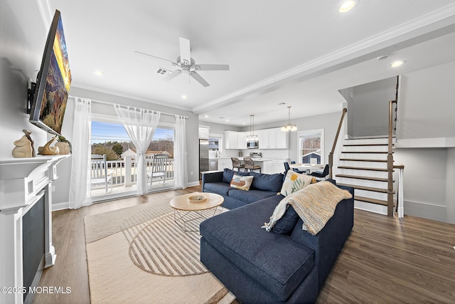 211 Pine Dr, Bayville, NJ 08721 - living area featuring a wealth of natural light, a ceiling fan, wood finished floors, and stairs