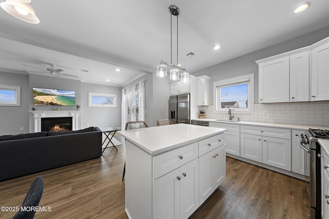 211 Pine Dr, Bayville, NJ 08721 - kitchen featuring open floor plan, a sink, backsplash, and stainless steel appliances