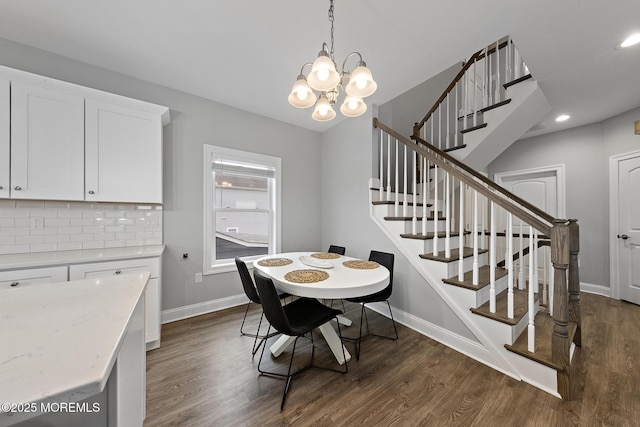 211 Pine Dr, Bayville, NJ 08721 - dining room featuring dark wood-style flooring, baseboards, stairway, and an inviting chandelier