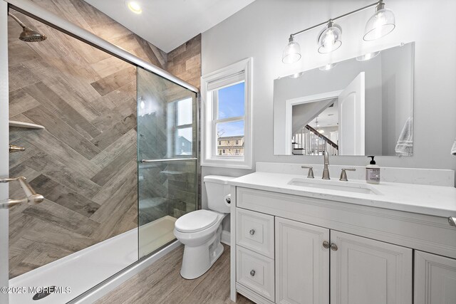 211 Pine Dr, Bayville, NJ 08721 - full bath with toilet, wood finished floors, vanity, and a shower stall