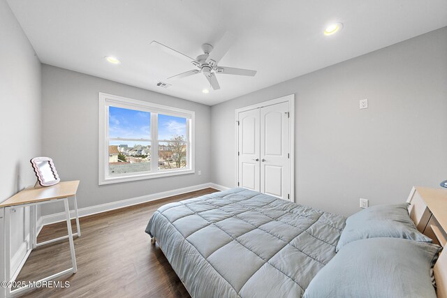 211 Pine Dr, Bayville, NJ 08721 - bedroom featuring visible vents, baseboards, a closet, recessed lighting, and wood finished floors
