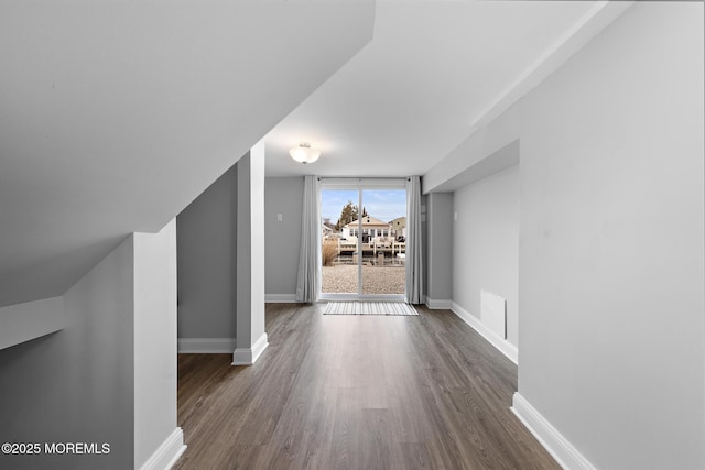 211 Pine Dr, Bayville, NJ 08721 - additional living space with dark wood-style flooring, visible vents, and baseboards