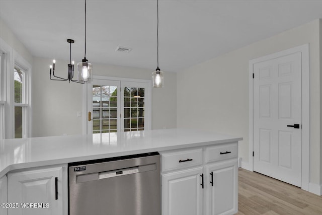 101 Torrey Pines Dr, Toms River, NJ 08757 - kitchen featuring stainless steel dishwasher, visible vents, white cabinets, and a healthy amount of sunlight