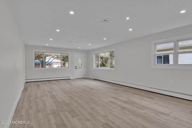 101 Torrey Pines Dr, Toms River, NJ 08757 - unfurnished living room with light wood finished floors, a baseboard heating unit, baseboards, and recessed lighting