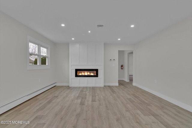 101 Torrey Pines Dr, Toms River, NJ 08757 - unfurnished living room featuring visible vents, light wood-style flooring, recessed lighting, and a baseboard heating unit