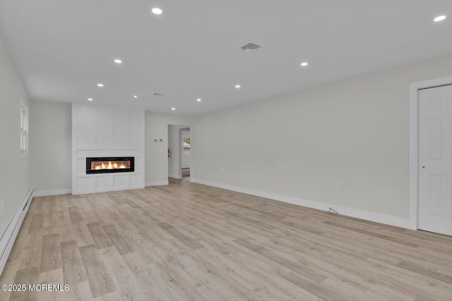 101 Torrey Pines Dr, Toms River, NJ 08757 - unfurnished living room with visible vents, a fireplace, baseboard heating, recessed lighting, and light wood-style flooring