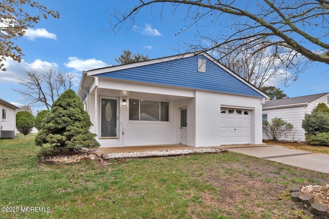 101 Torrey Pines Dr, Toms River, NJ 08757 - view of front facade featuring an attached garage, driveway, a front yard, and brick siding