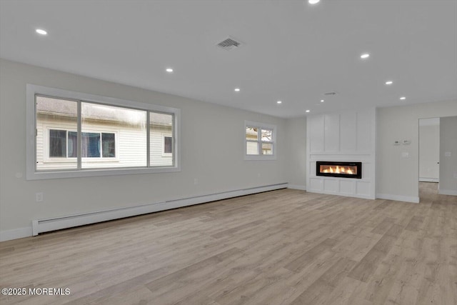 101 Torrey Pines Dr, Toms River, NJ 08757 - unfurnished living room with light wood-style floors, recessed lighting, baseboard heating, and baseboards