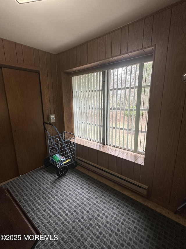10 Homestead Dr Unit C, Whiting, NJ 08759 - carpeted spare room featuring wooden walls and a baseboard heating unit