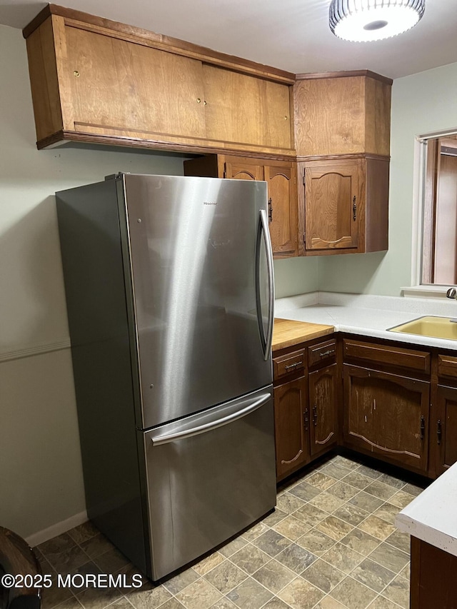 10 Homestead Dr Unit C, Whiting, NJ 08759 - kitchen with a sink, light countertops, and freestanding refrigerator
