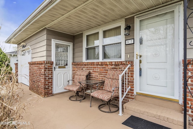 37 Scarborough Pl, Toms River, NJ 08757 - view of exterior entry with a porch and brick siding