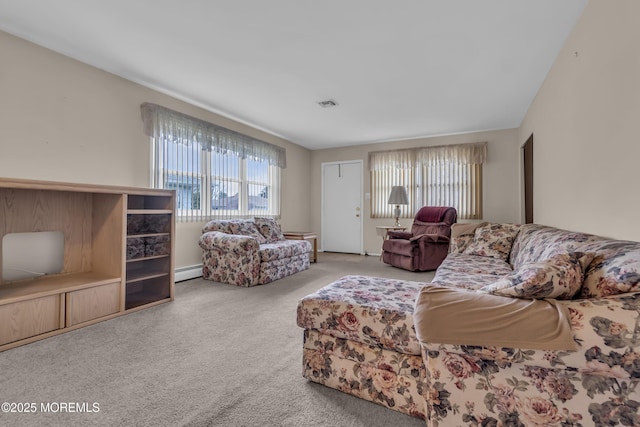 37 Scarborough Pl, Toms River, NJ 08757 - carpeted living area with visible vents, a baseboard heating unit, and a healthy amount of sunlight
