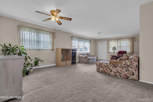 37 Scarborough Pl, Toms River, NJ 08757 - living area featuring carpet flooring, a baseboard heating unit, a ceiling fan, and a wealth of natural light