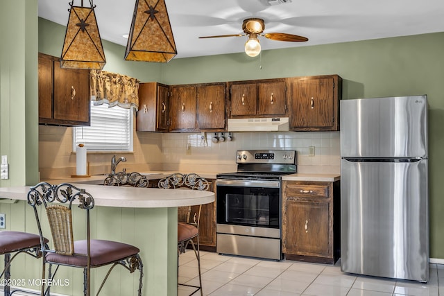 37 Scarborough Pl, Toms River, NJ 08757 - kitchen with a sink, light countertops, appliances with stainless steel finishes, and under cabinet range hood