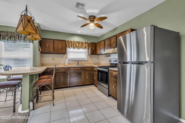 37 Scarborough Pl, Toms River, NJ 08757 - kitchen featuring light countertops, under cabinet range hood, visible vents, appliances with stainless steel finishes, and a sink
